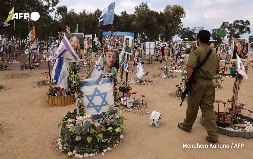 An Israeli soldier visits an installation honouring those who were killed and kidnapped in the Supernova music festival during the October 7 attacks by Palestinian militants, at the site of the festival near Kibbutz Reim in southern Israel on October 6, 2024. 