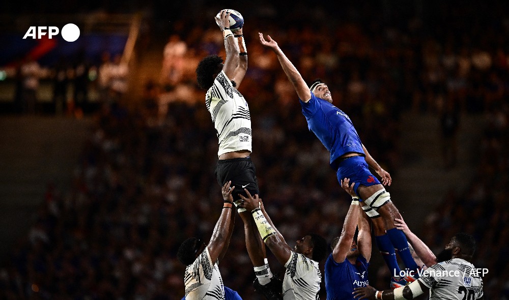 Fiji's lock Isoa Nasilasila leaps for the ball in a lineout with France's flanker Dylan Cretin (R) during the pre-World Cup friendly rugby union international match between France and Fiji at The Stade de la Beaujoire in Nantes, France.