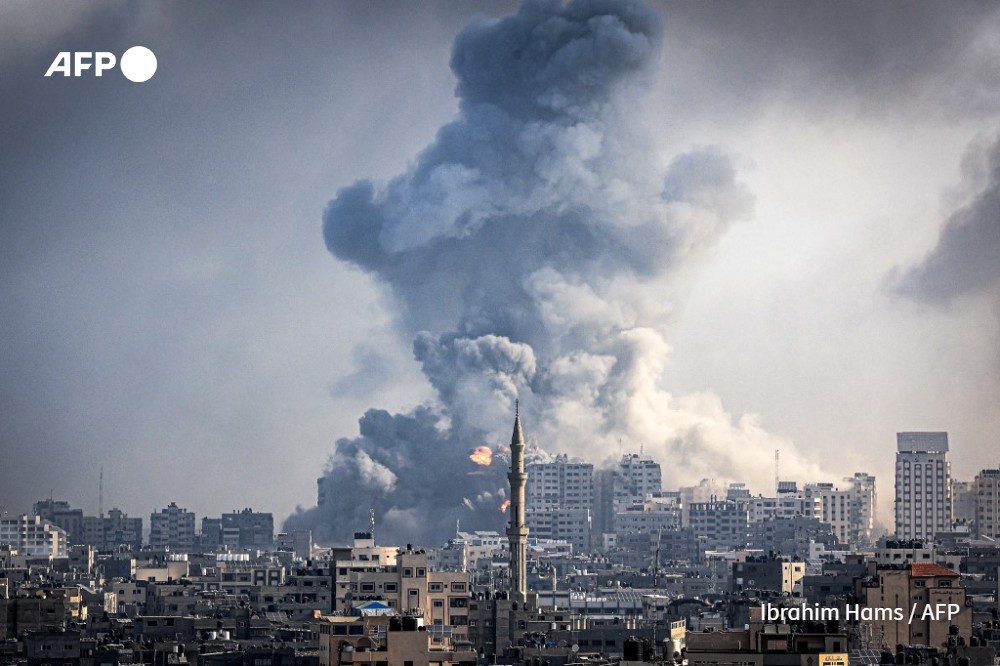 Smoke plumes billow during Israeli air strikes in Gaza City 