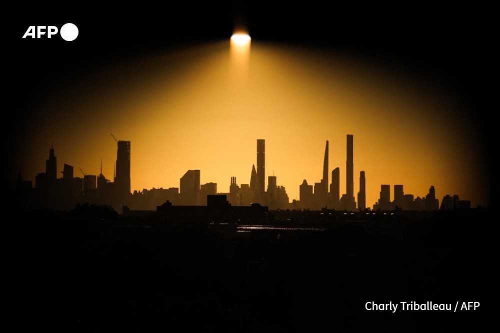 The Manhattan skyline is seen at sunset from Louis Armstrong Stadium during the US Open tennis tournament at the USTA Billie Jean King National Tennis Center in New York City, on September 2, 2024.