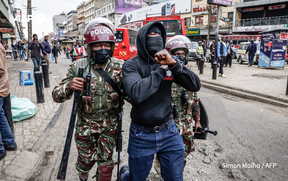 Kenyan security forces detain protester during demonstration