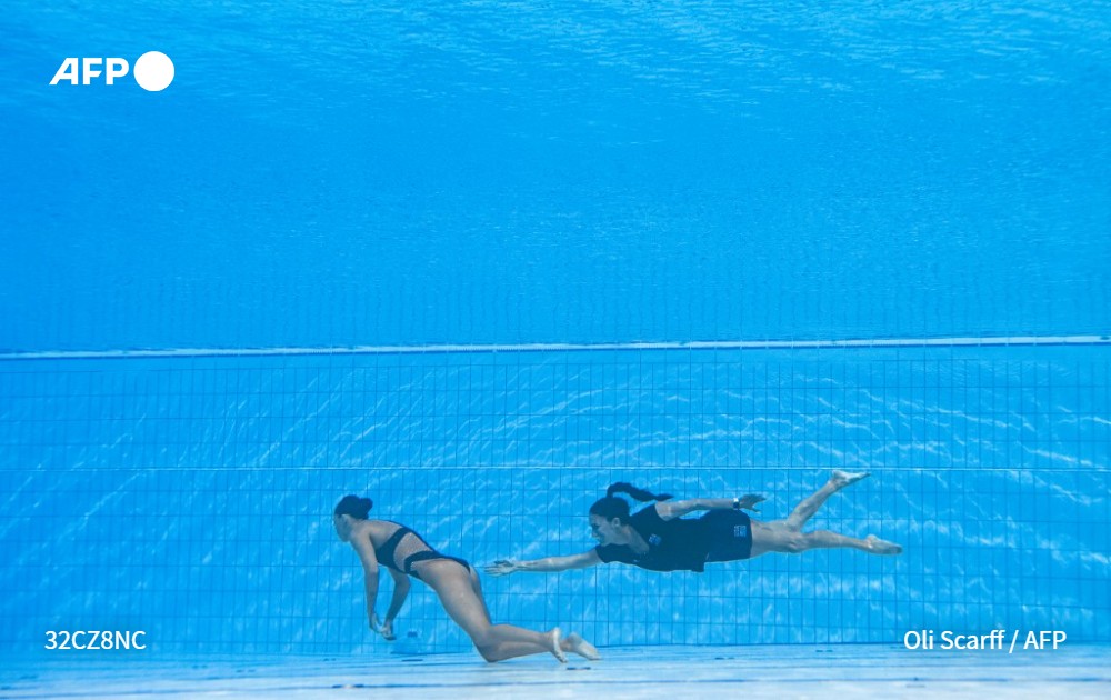 Oli Scaff picture of USA’s coach Andrea Fuentes recovering swimmer Anita Alvarez, from the bottom of the pool during an incident in the women’s solo free artistic swimming finals during the Budapest 2022 World Aquatics Championships at the Alfred Hajos Swimming Complex in Budapest, Hungary on June 22, 2022.